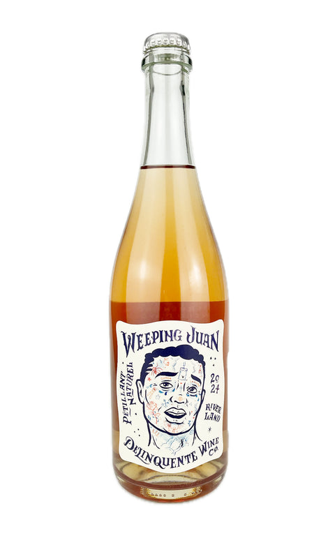 A bottle of Weeping Juan rosé Pet Nat wine with a label depicting a face from the Australian winery 'Delinquente Wine Co.' Organic sparkling wine.